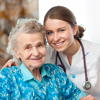 Female nurse with an elderly lady patient